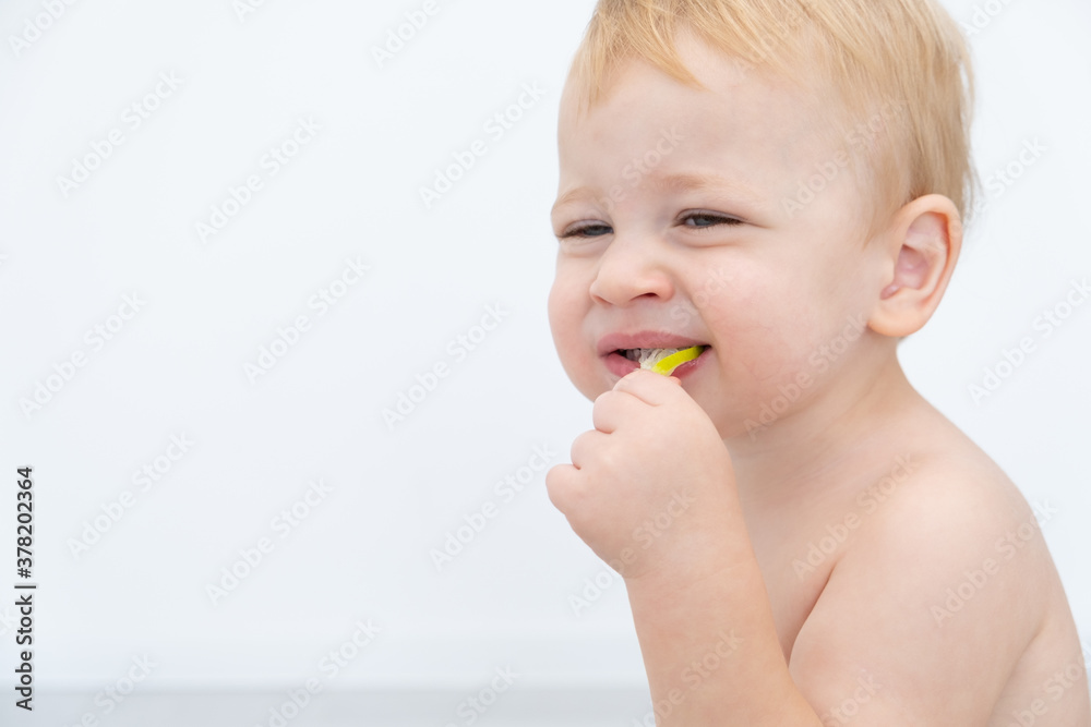 Baby boy trying and tasting new food. Dieting, vegetarian and healthy nutrition concept. Baby boy trying and tasting new food. Dieting, vegetarian and healthy nutrition concept.