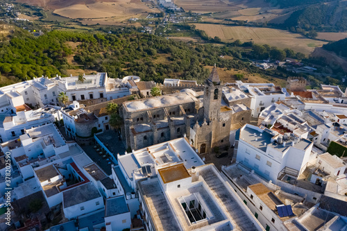 Aerial drone image of a white andalusian town in south Spain with church