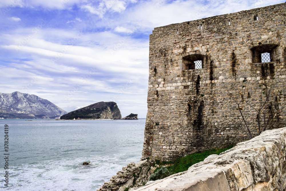 An old stone tower overlooking Adriatic Sea, in the historic city of Budva, in Montenegro.