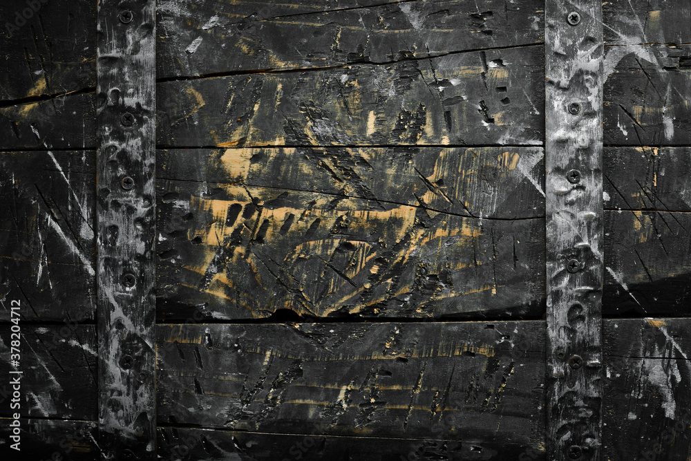 Old kitchen wooden board. Black stone background. Top view. Rustic style.