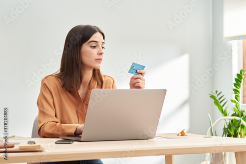 Young lady making online transaction