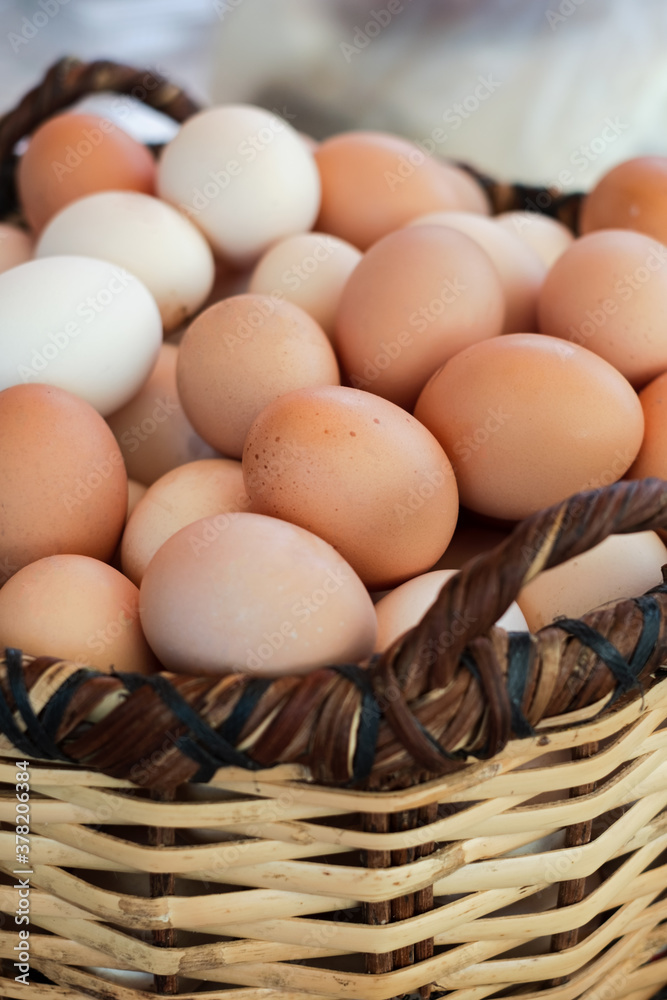 Basket with chicken eggs on farmers market Basket with chicken eggs on farmers market