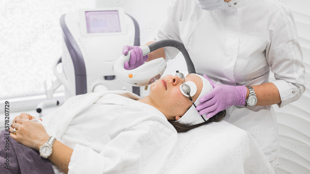 Photo rejuvenation procedure performed by a dermatologist Photo rejuvenation procedure performed by a dermatologist