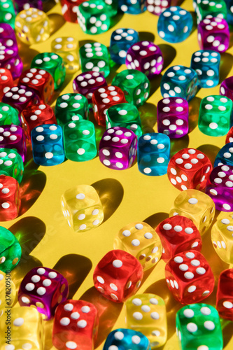 Isolated die amongst many colorful dice