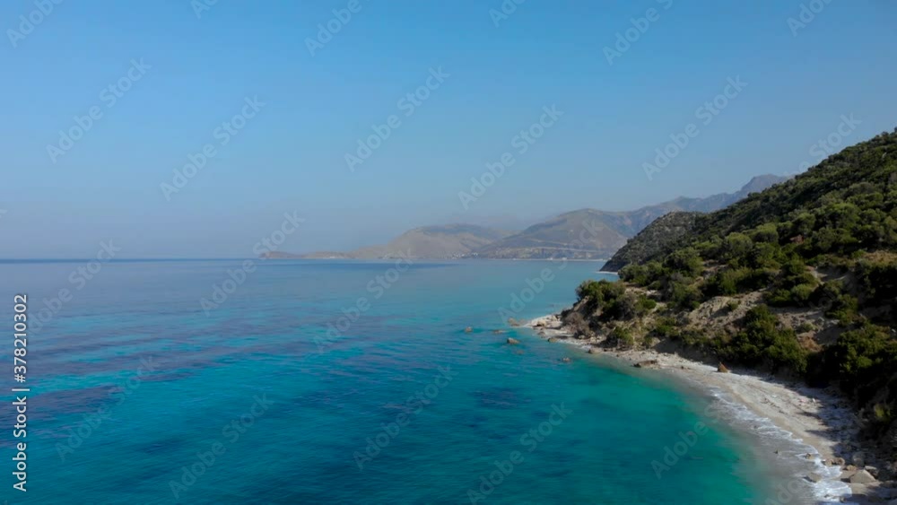 Hidden beaches on beautiful coastline of Mediterranean with azure sea water and mountains background Hidden beaches on beautiful coastline of Mediterranean with azure sea water and mountains background
