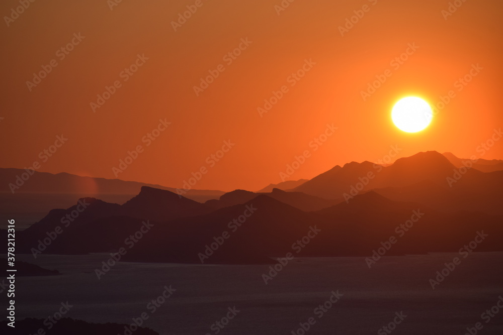 Beautiful sunset from the mountains with the sea in the background