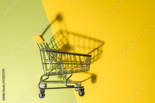 Mini shopping cart retail on colorful background