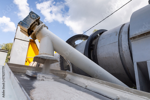 Industrial production of construction mixtures. Tower silos with bulk ingredients. Line for drying and sorting of sand. photo