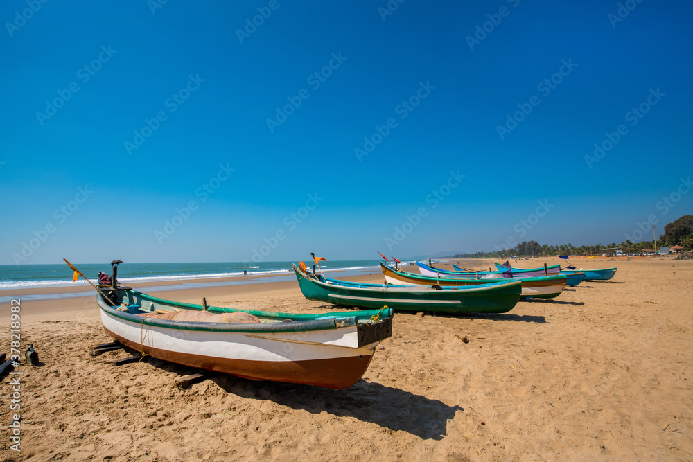 Idyllic scene at South Asia (India ): fishing boats on the sand and beach of Indian Ocean Idyllic scene at South Asia (India ): fishing boats on the sand and beach of Indian Ocean