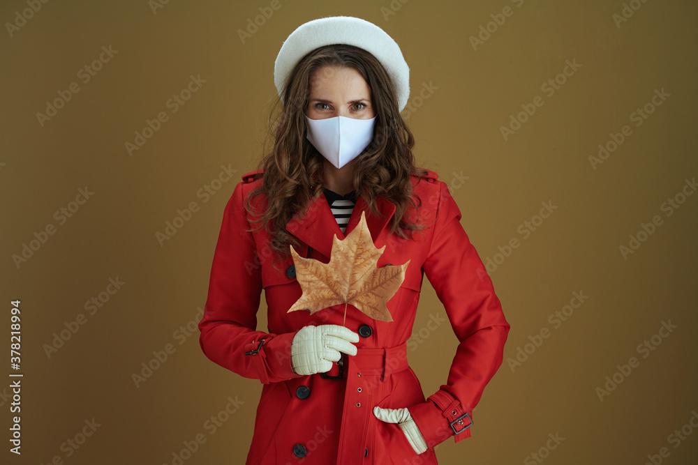 trendy housewife in red coat isolated on beige background trendy housewife in red coat isolated on beige background