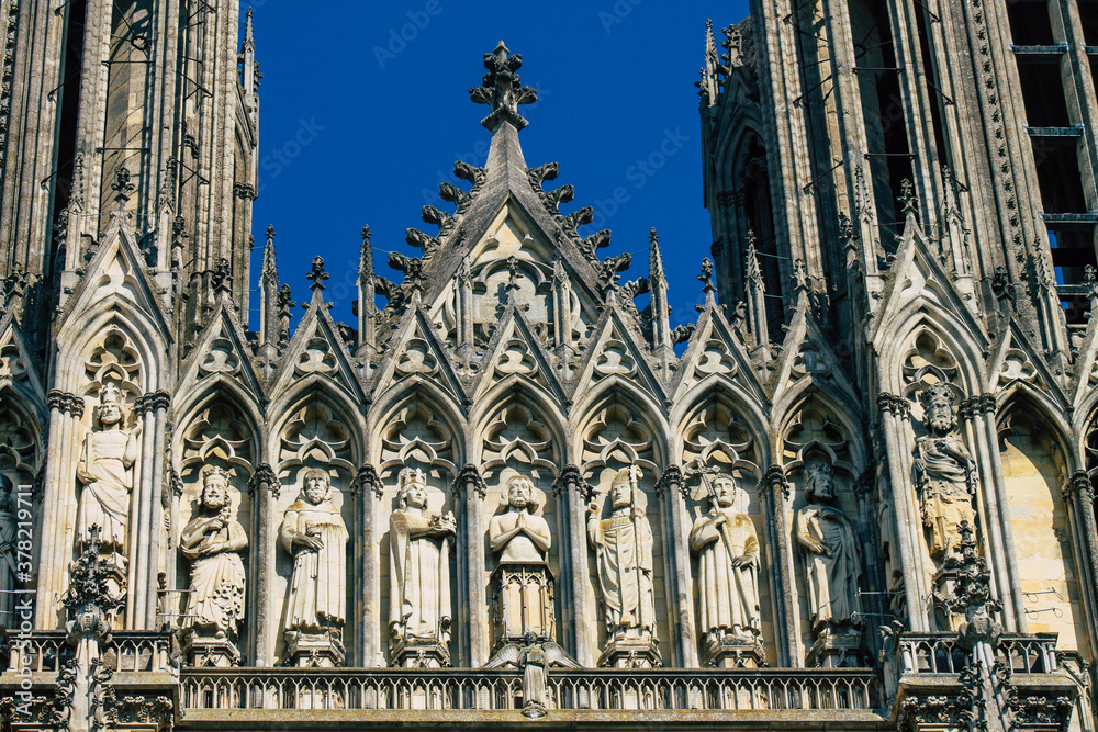 View of the exterior facade of the Roman Catholic Notre Dame de Reims Cathedral, a historical monument in the Grand Est region of France and one of the oldest in Europe