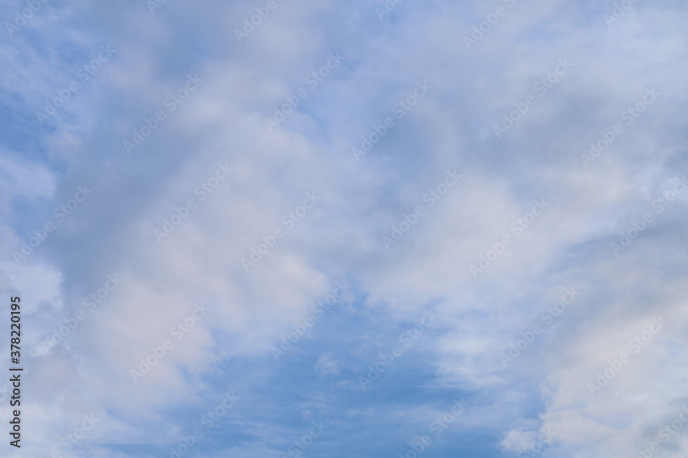 Abstract background of white fluffy clouds on a bright blue sky Abstract background of white fluffy clouds on a bright blue sky