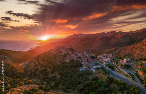 Amazing view over Vathia village against a dramatic sunset sky. Vathia, Mani, Laconia, Peloponnese, Greece