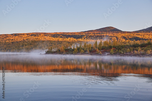Fototapeta Naklejka Na Ścianę i Meble -  Autumn foggy frosty morning on the lake. Sunrise. Kolyma IMG4560
