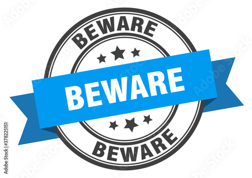 beware label sign. round stamp. band. ribbon