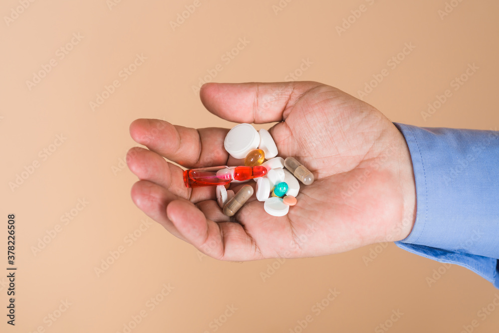 Aid. Hands with pills. Pills prescribed by doctor. Medicine, treatments and healthcare. Medicine pills in hand. Tablets in hand of patient. Medical concept. Hand of man holds different pills. Aid. Hands with pills. Pills prescribed by doctor. Medicine, treatments and healthcare. Medicine pills in hand. Tablets in hand of patient. Medical concept. Hand of man holds different pills.