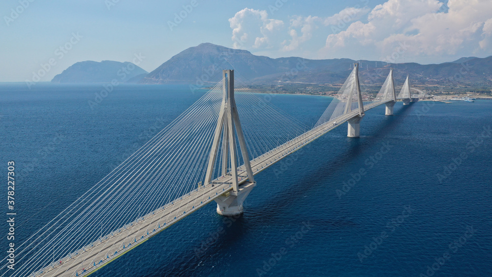 Aerial bird's eye drone photo of state of the art suspension bridge crossing the sea