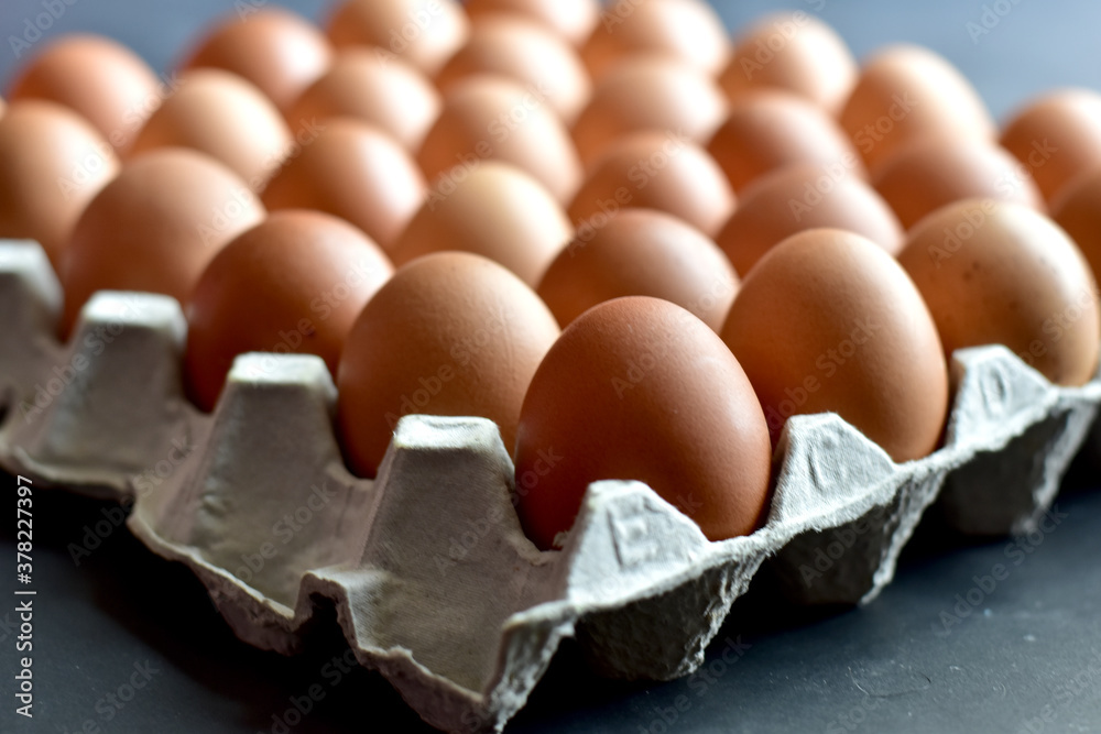 Close up Raw Brown Chicken Eggs, Easter eggs In Paper Container, selective focus points. Close up Raw Brown Chicken Eggs, Easter eggs In Paper Container, selective focus points.