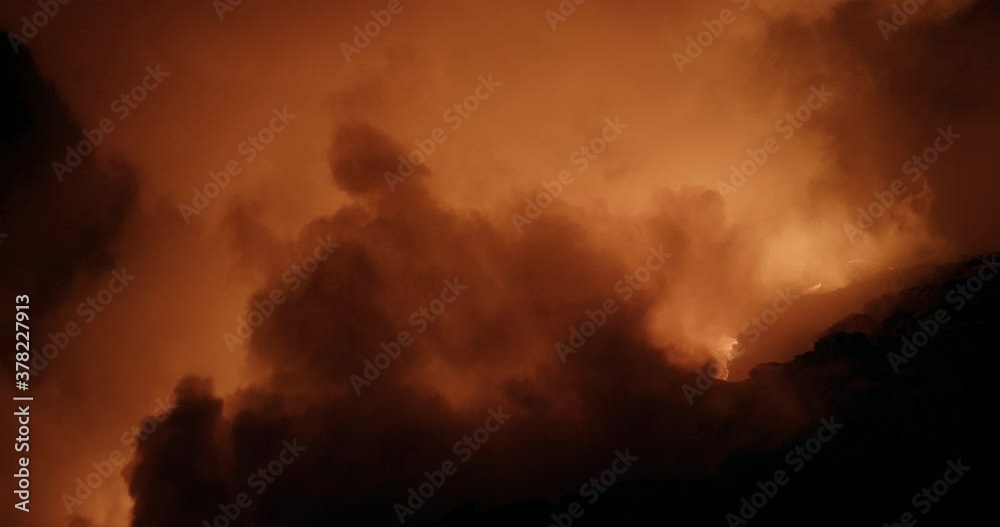 Flowing lava smoke at night, wide Flowing lava smoke at night, wide