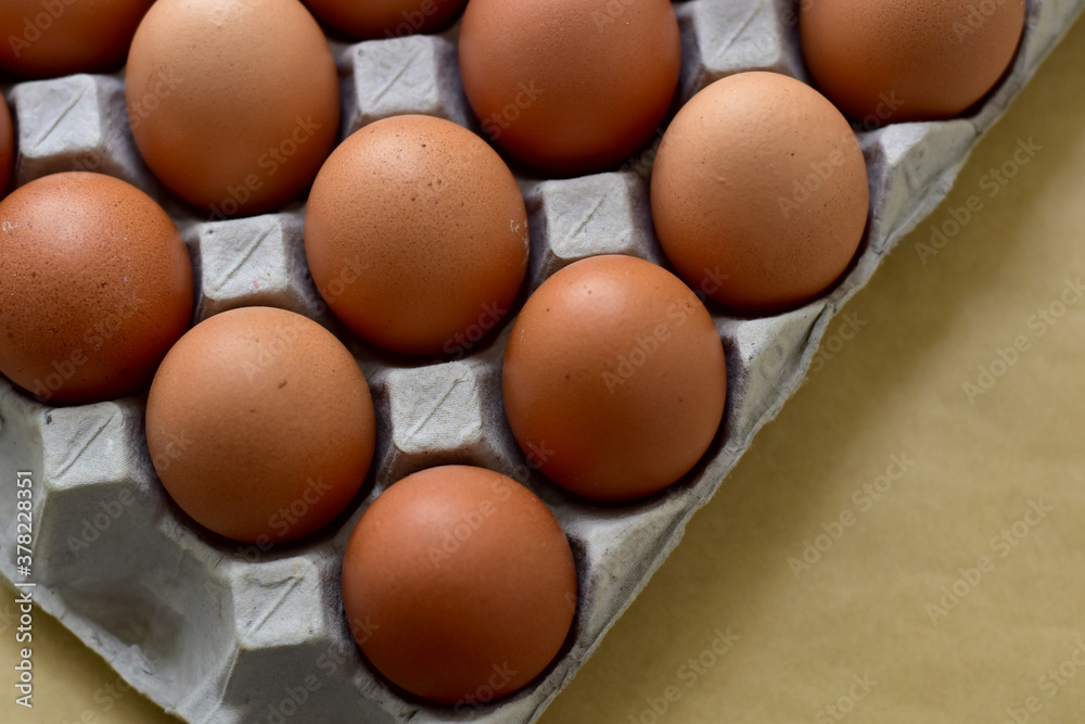 Close up Raw Brown Chicken Eggs, Easter eggs In Paper Container, selective focus points. Close up Raw Brown Chicken Eggs, Easter eggs In Paper Container, selective focus points.