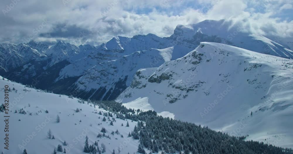 Wide aerial, snowy mountain landscape in Banff National Park
