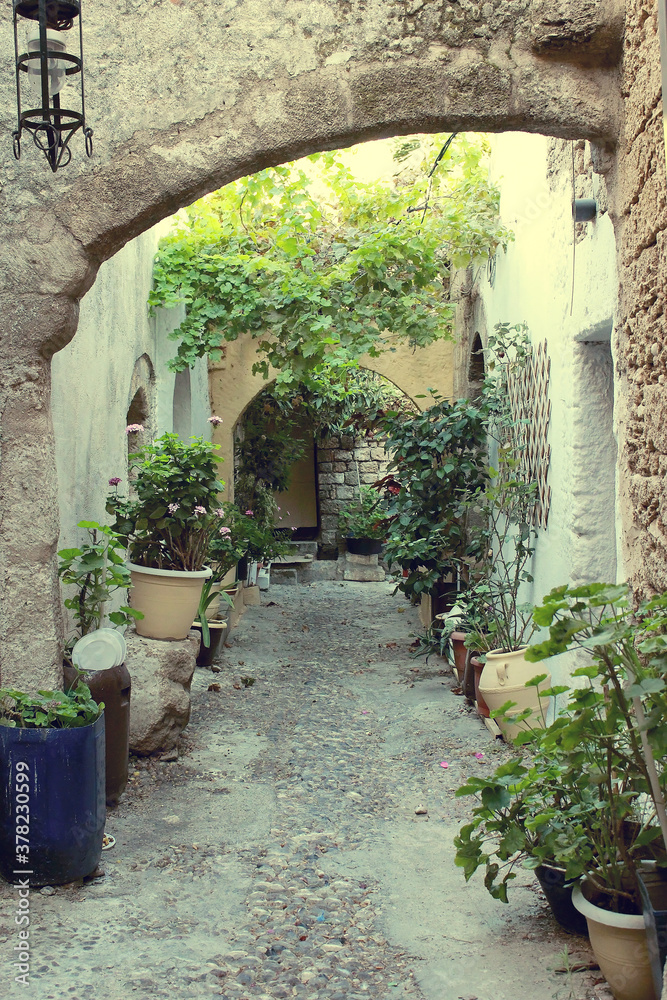 Naklejka premium The ancient streets of the ancient city in Greece. Authentic alleys of Rhodes.