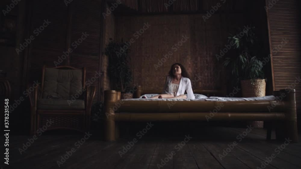 Sexy young woman sleeping in bedroom. Woman wakes up in bedroom Sexy young woman sleeping in bedroom. Woman wakes up in bedroom