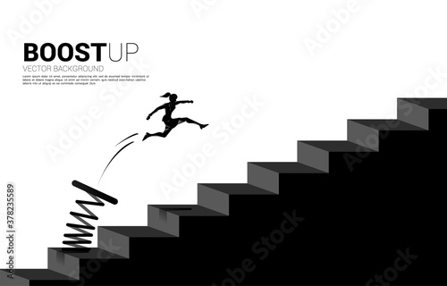 silhouette of businesswoman jumping to pass step with springboard,. Business Concept of targeting and customer.route to success.