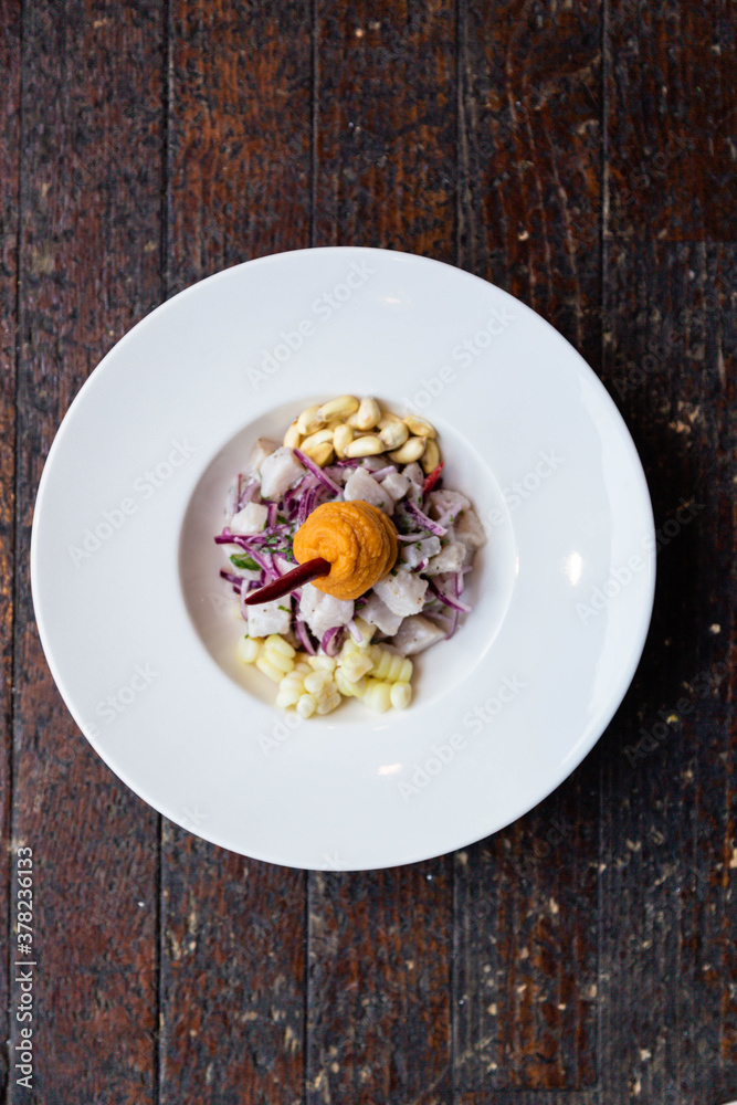 Ceviche with sweet potato, white corn and red onion. Peruvian food in the Mediterranean of the island of Majorca.