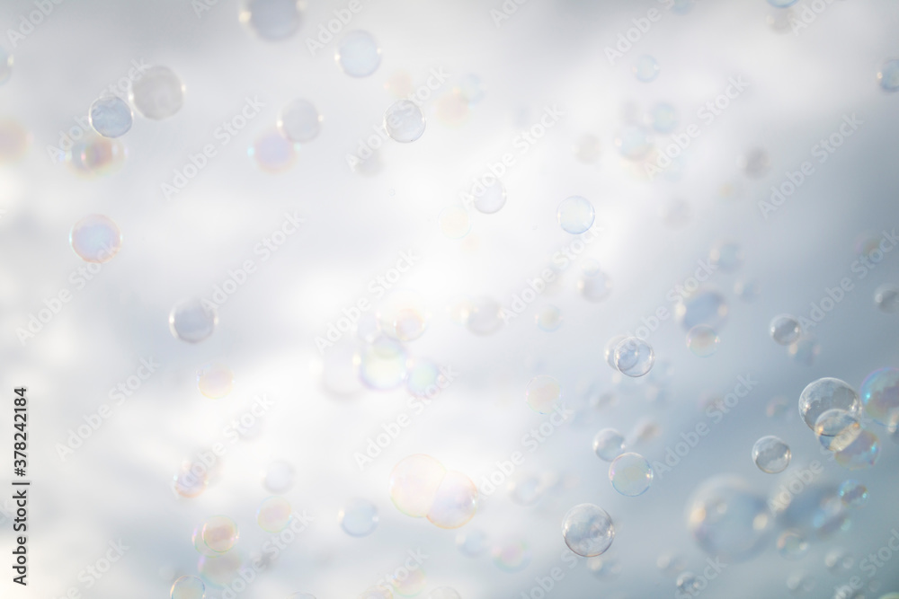 many soap bubbles on a cloud background many soap bubbles on a cloud background