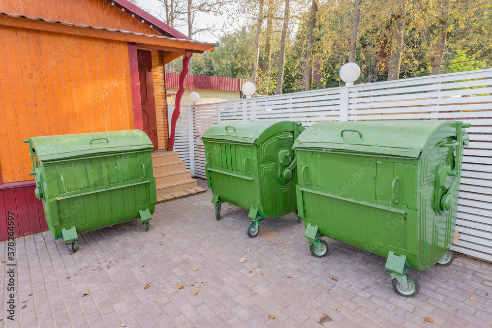 Metal containers for the waste collection by the supermarket bullding. Metal containers for the waste collection by the supermarket bullding.