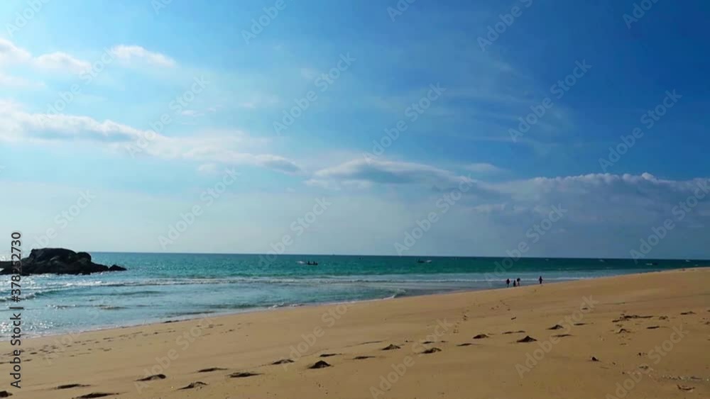 Footprints on exotic sandy beach with deep blue sea water & calm ocean wave crashing seashore in beautiful sunny clear blue sky with white clouds background in summer sunlight, Cinemagraphs B-roll Footprints on exotic sandy beach with deep blue sea water & calm ocean wave crashing seashore in beautiful sunny clear blue sky with white clouds background in summer sunlight, Cinemagraphs B-roll