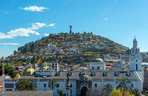 Metropolitan Cathedral facade with the Panecillo Hill in the background and the Virgin of Quito on top, Quito, Ecuador.