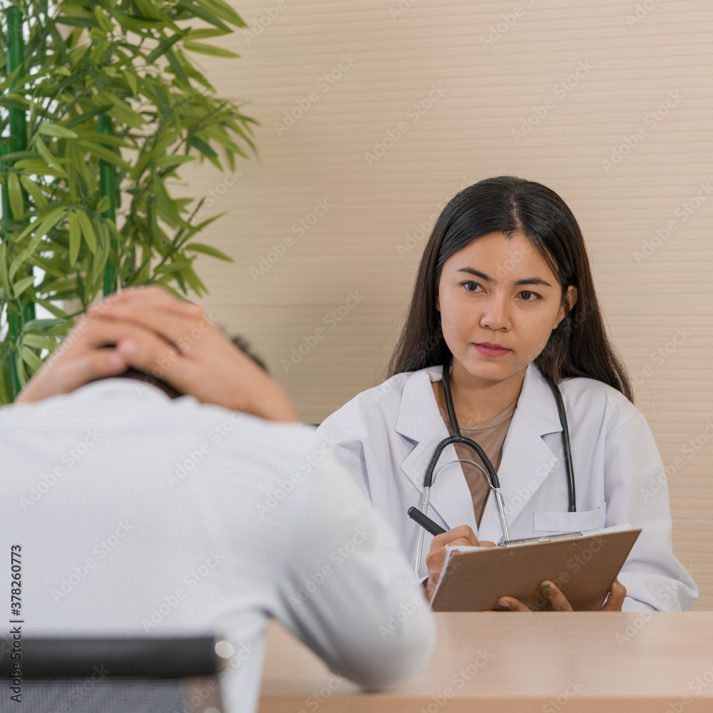 Female doctor meeting with patient in the office, healthcare and medicine concept Female doctor meeting with patient in the office, healthcare and medicine concept
