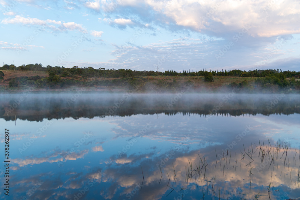 Fototapeta premium beautiful calm lake at sunrise