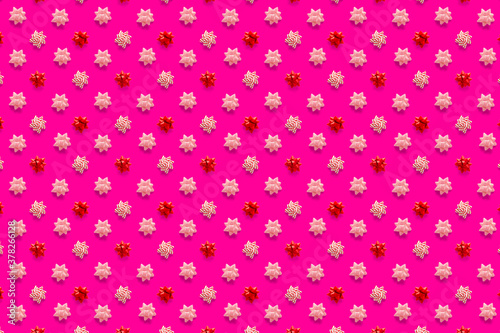 modern christmas background on pink backdrop. creative flat lay for christmas time, banners, posters, prints and other creative works.