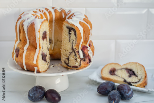 German Gugelhupf cake with plums and poppy seed photo