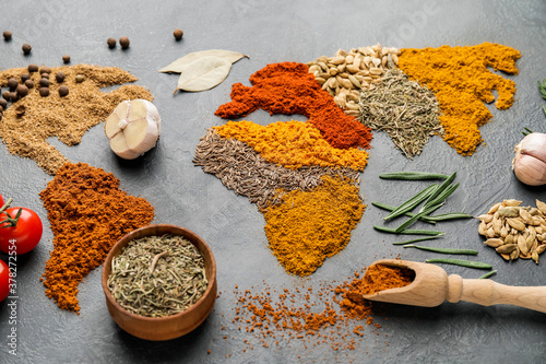 Fototapeta Naklejka Na Ścianę i Meble -  World map made of different spices on grey background
