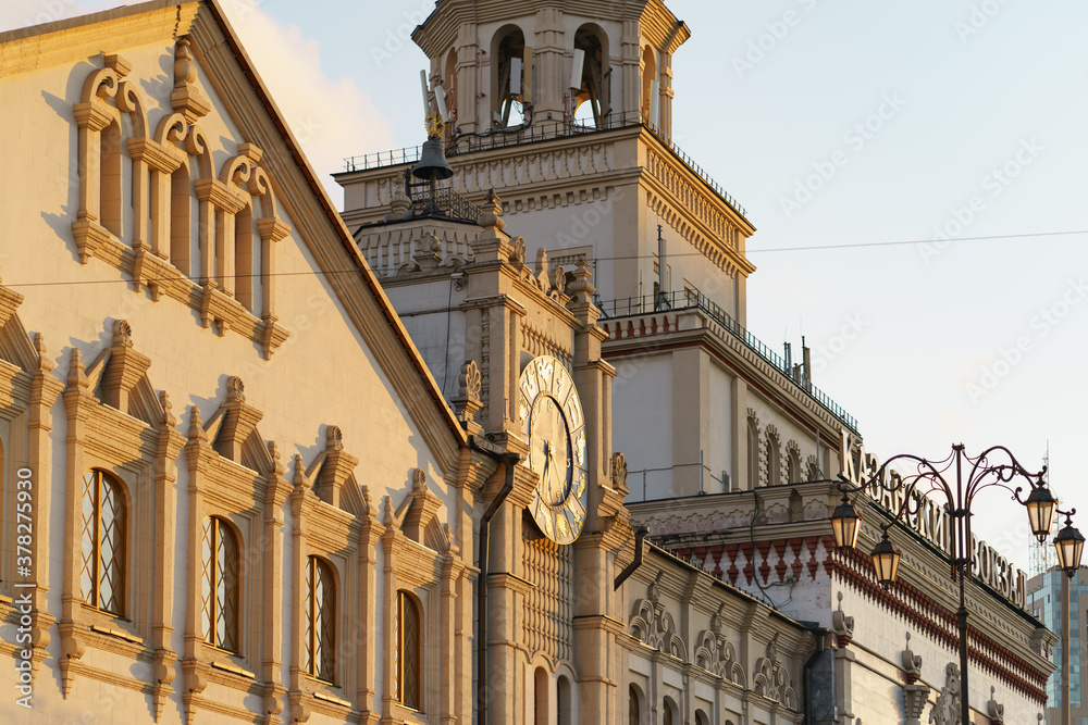 Moscow cityscape at autumn sunset after the rain. Building of the Moscow Kazansky railway station. Big old city clocks. Traveling theme.