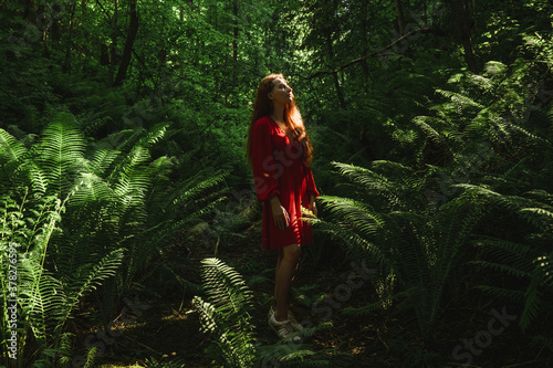 The young woman in fern forest.