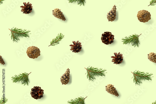 seamless christmas pattern from Pine cones on green background. modern pine cone christmas collage. Print for paper, fabric, wallpaper pinecones