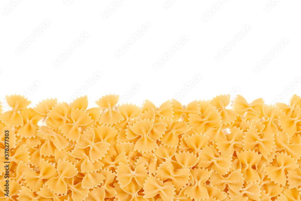 Italian pasta border for menu design template, raw farfalle over white background with copy space. Uncooked raw farfalle pasta on white background. Space for text Italian pasta border for menu design template, raw farfalle over white background with copy space. Uncooked raw farfalle pasta on white background. Space for text