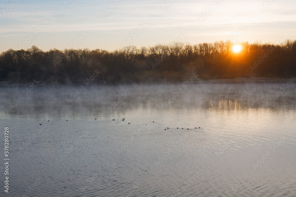 Fototapeta premium Sunset river horizon sky clouds. River sunset landscape. Sunset river view. Sunset river panorama