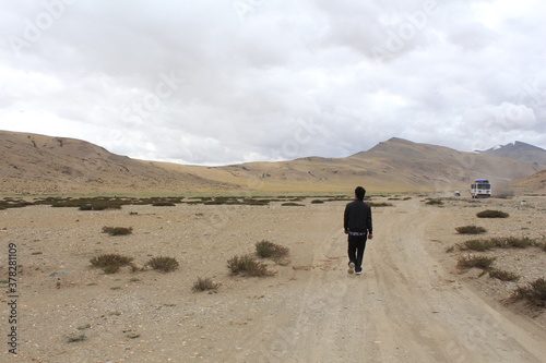 A man walking in mountain of ladakh