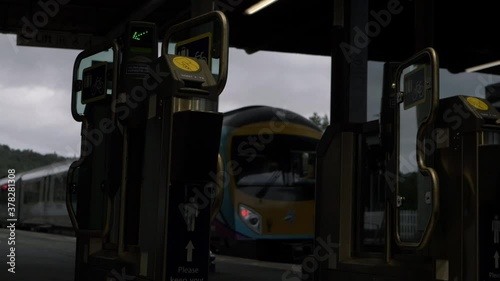 Wallpaper Mural Ticket machines as train leaves station wide shot Torontodigital.ca