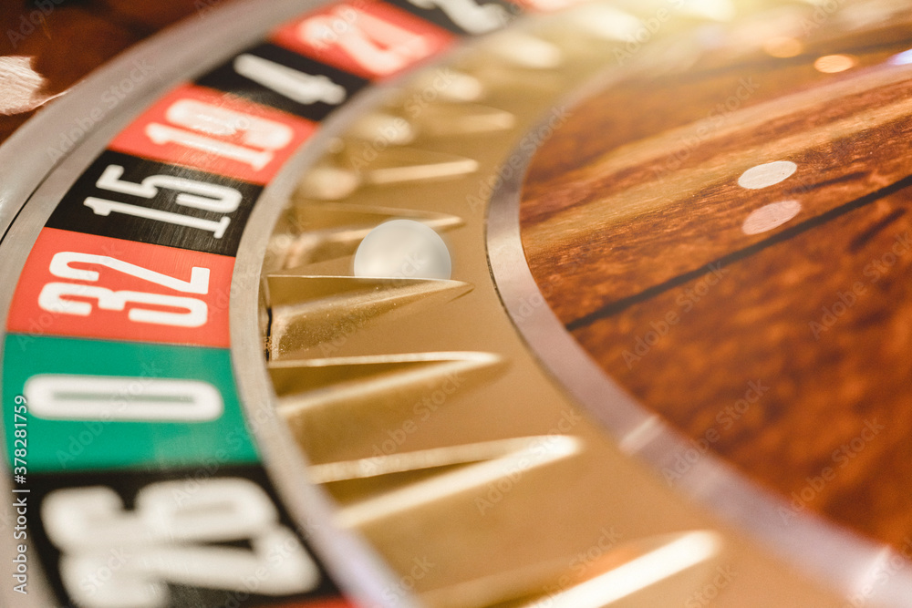 Close up view of roulette wheel with the ball.Gambling wheel in casino Close up view of roulette wheel with the ball.Gambling wheel in casino