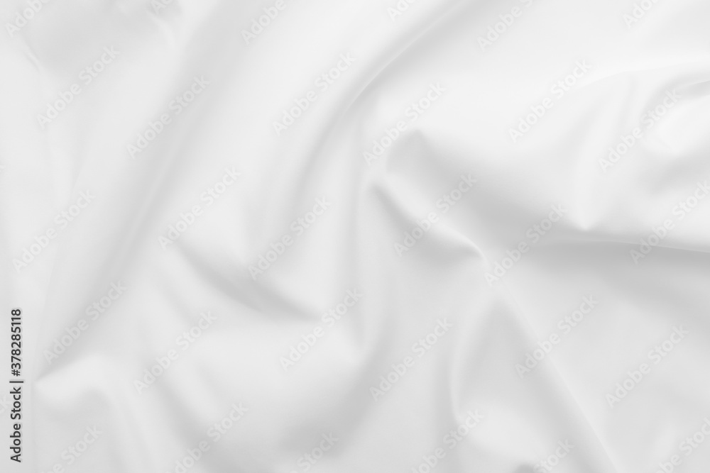 Abstract white fabric texture background. Cloth soft wave. Creases of satin, silk, and cotton.	