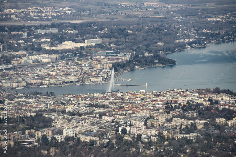 Aerial view of Geneva (Switzerland) with its famous water spring, city center, buildings and ngos taken with a telephoto lens (200mm)
