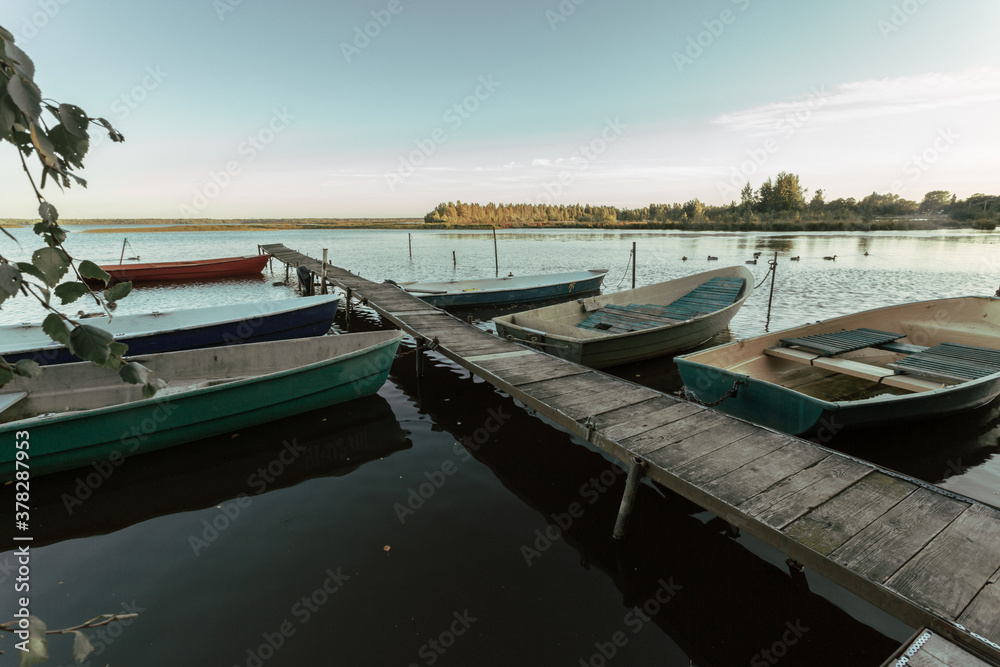 Beautiful pier with fisherman's wooden boats at rest.