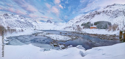 Marwelous winter scene of Kartfjorden on Vestvagoy island with snowy mountain peaks on Lofoten Islands